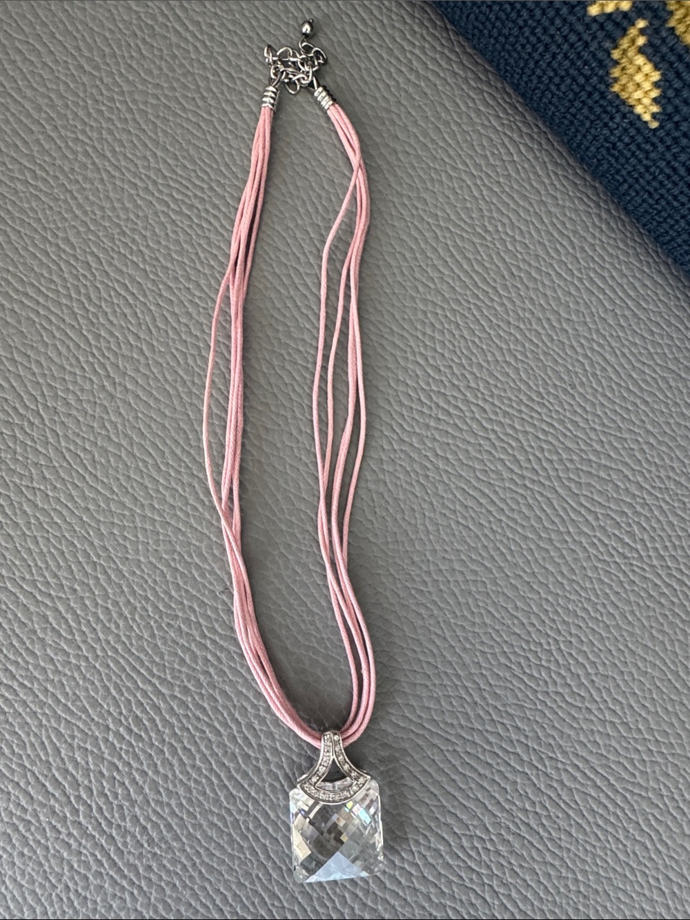 STERLING SILVER WITH SQUARE CRYSTAL PENDANT ON PINK SILK CORDED NECKLACE UNCAS